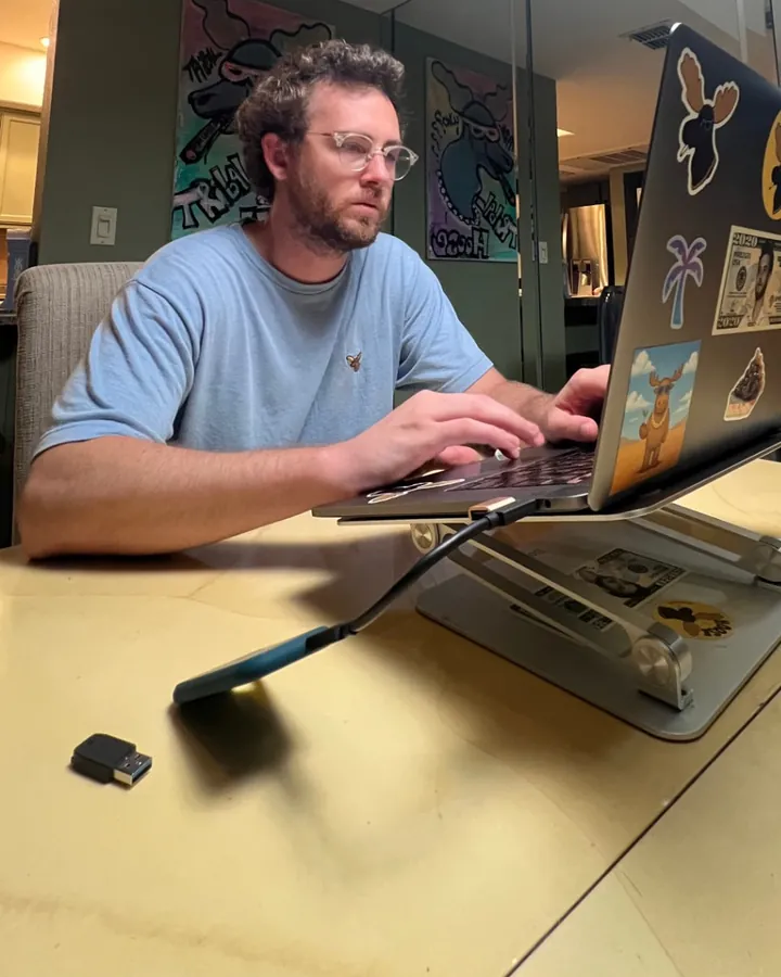 Mr B working on his laptop